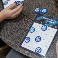 Close up of bingo card with Laker bingo chips on it